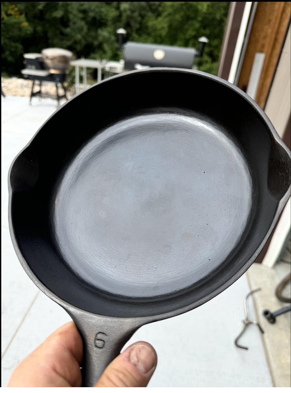 Finished number 6 skillet with smooth machined cooking surface, fresh off the smoker